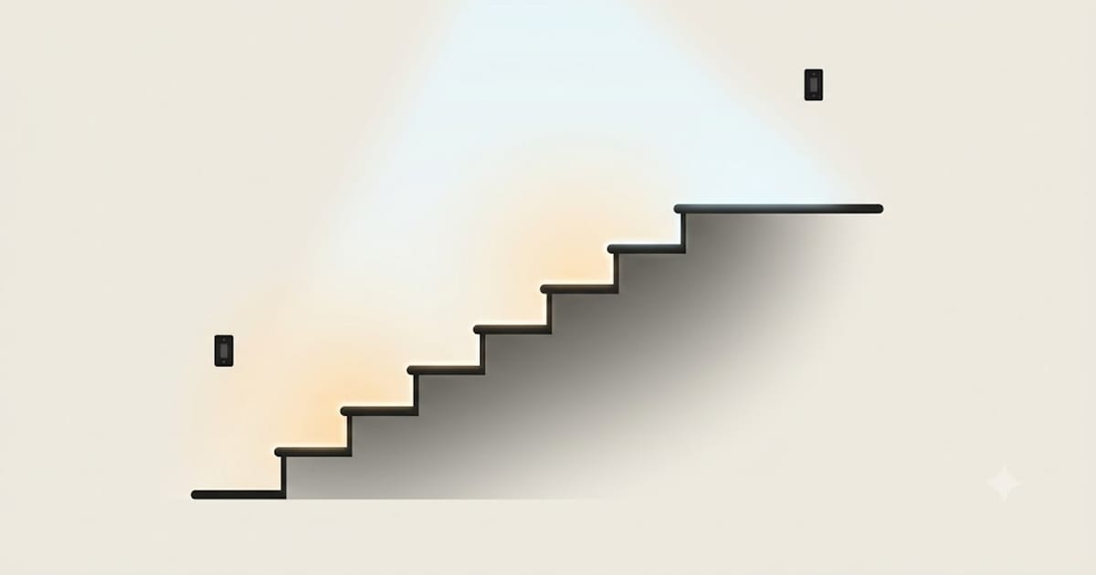 A staircase lit so each tread edge is visible with a switch at the top and bottom